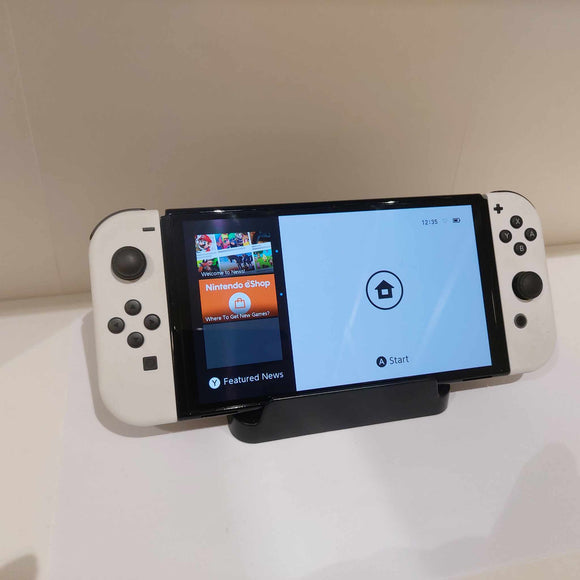 OLED Nintendo Switch with White Joycon controllers