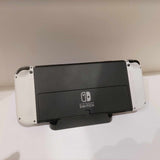 OLED Nintendo Switch with White Joycon controllers