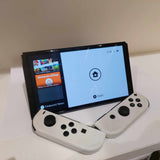 OLED Nintendo Switch with White Joycon controllers